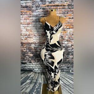 Maxi tropical dress with flowers.  Size small but has plenty of stretch.